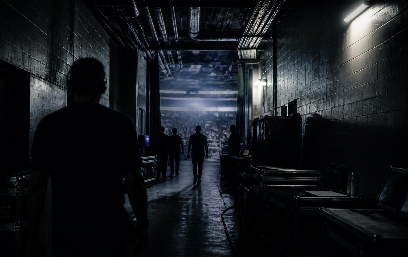 Backstage arena corridor before a fight night